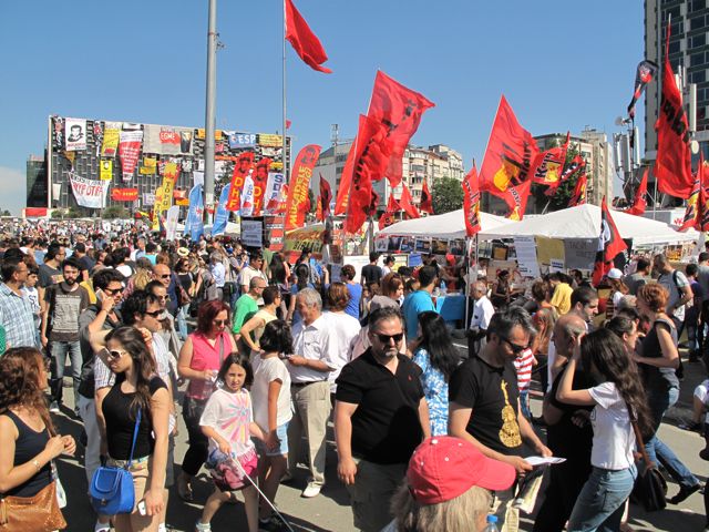 A line of stands in Taksim Square in front of the old Ataturk Culture Centre, now a corkboard of revolutionary slogans 