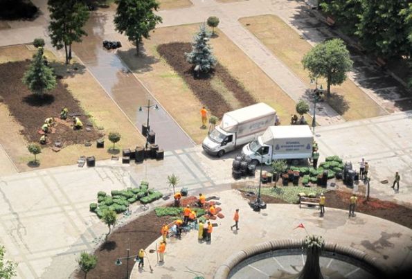 Fixing the Gezi Park flowerbeds, the morning after the Taksim Commune was ejected.