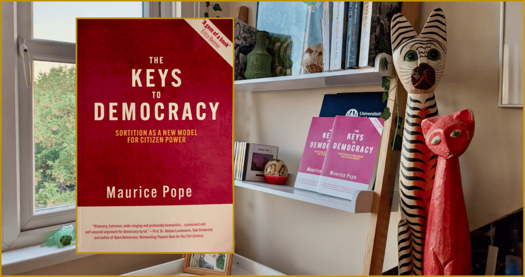 The new paperback version of the book "The Keys to Democracy" against a background of a London apartment